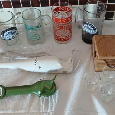 Glass beer mugs, can opener, Shit glasses, and a nice Drink mixer for your bar!