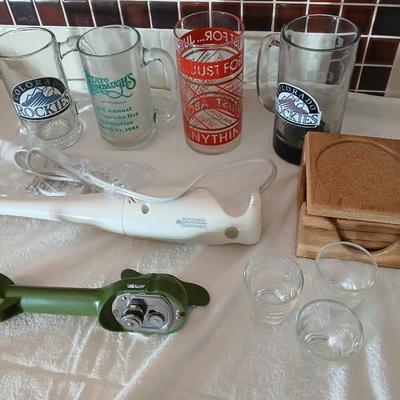 Glass beer mugs, can opener, Shit glasses, and a nice Drink mixer for your bar!