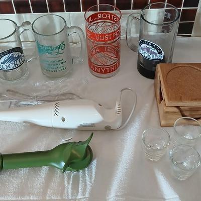 Glass beer mugs, can opener, Shit glasses, and a nice Drink mixer for your bar!