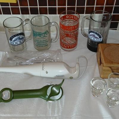 Glass beer mugs, can opener, Shit glasses, and a nice Drink mixer for your bar!