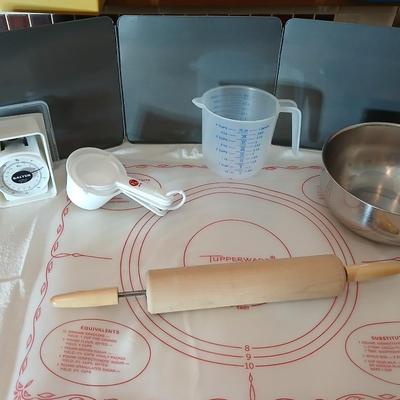 Baking items - measuring cup, Tupperware pad, small kitchen scale, rolling pin and a mixing bowl