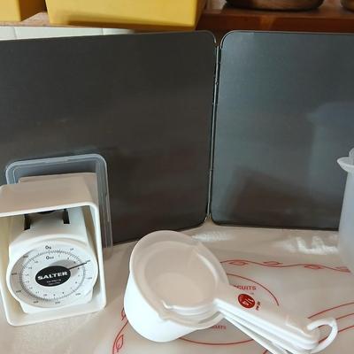 Baking items - measuring cup, Tupperware pad, small kitchen scale, rolling pin and a mixing bowl