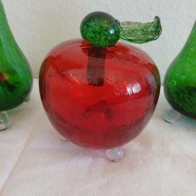 Two glass pears with a glass apple with removable stems