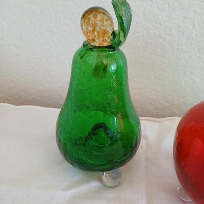 Two glass pears with a glass apple with removable stems