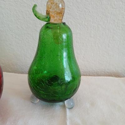 Two glass pears with a glass apple with removable stems