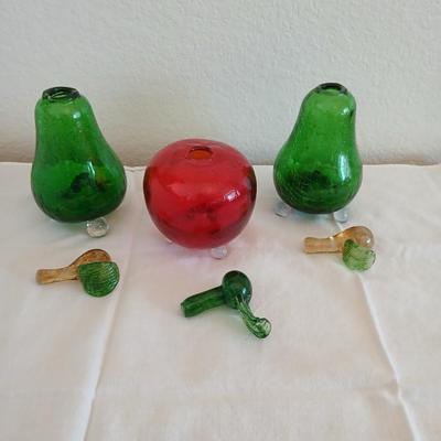 Two glass pears with a glass apple with removable stems