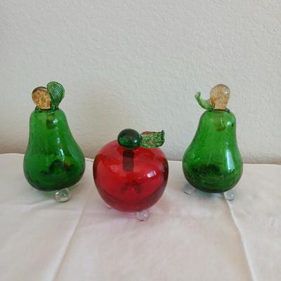 Two glass pears with a glass apple with removable stems