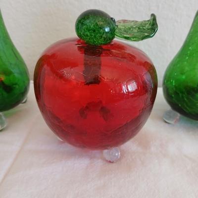 Two glass pears with a glass apple with removable stems