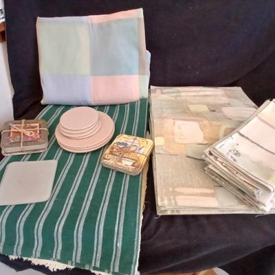 Table linens, placemats, kitchen towels, and corked back hot plate pads