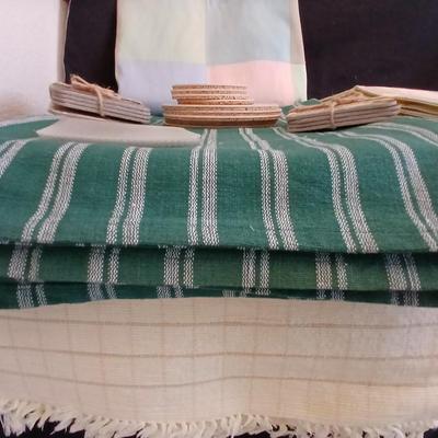 Table linens, placemats, kitchen towels, and corked back hot plate pads