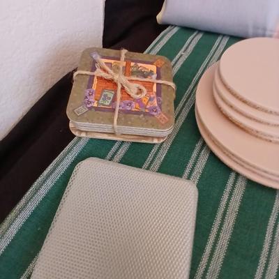 Table linens, placemats, kitchen towels, and corked back hot plate pads