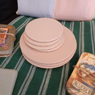Table linens, placemats, kitchen towels, and corked back hot plate pads
