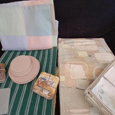 Table linens, placemats, kitchen towels, and corked back hot plate pads