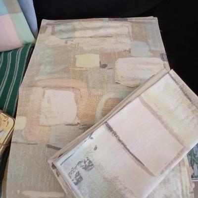 Table linens, placemats, kitchen towels, and corked back hot plate pads