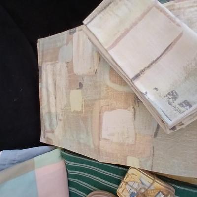 Table linens, placemats, kitchen towels, and corked back hot plate pads