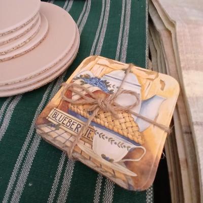 Table linens, placemats, kitchen towels, and corked back hot plate pads