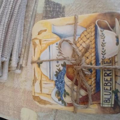 Table linens, placemats, kitchen towels, and corked back hot plate pads