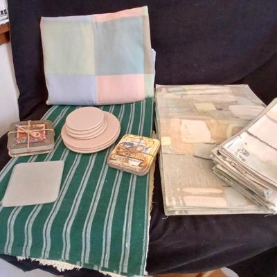 Table linens, placemats, kitchen towels, and corked back hot plate pads