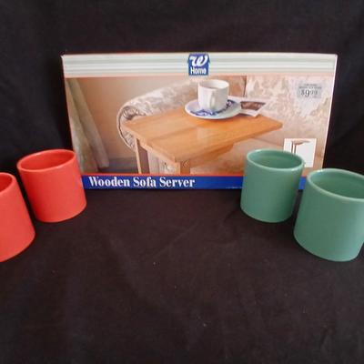 Four large coffee mugs and a brand-new wooden sofa server