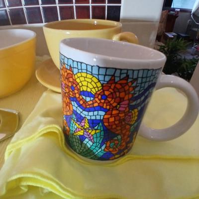 Kitchen items - placemats, small Pyrex mixing bowl, mug, napkins, kitchen towels, and more