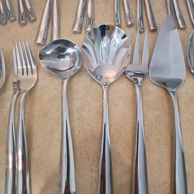 Really nice Artisan ware forged stainless flatware / silverware set with matching serving ware