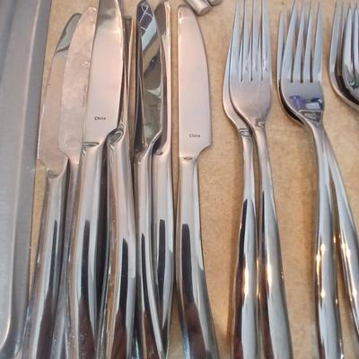 Really nice Artisan ware forged stainless flatware / silverware set with matching serving ware