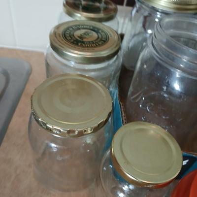 Glass jars of all sizes and shapes - some with lids - some without.