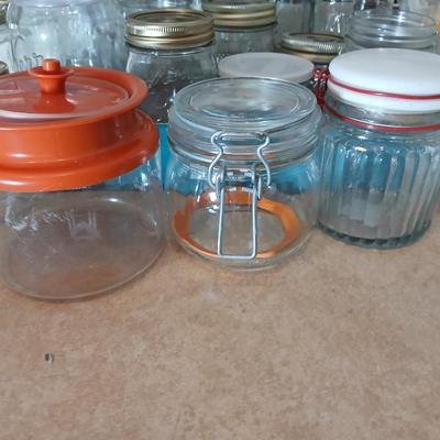 Glass jars of all sizes and shapes - some with lids - some without.