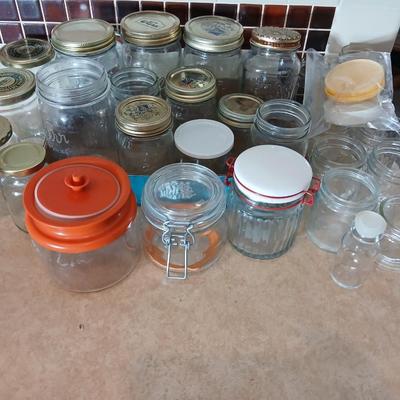 Glass jars of all sizes and shapes - some with lids - some without.