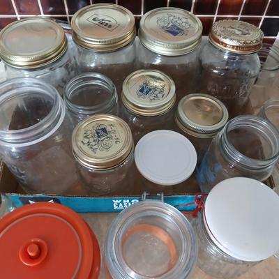 Glass jars of all sizes and shapes - some with lids - some without.