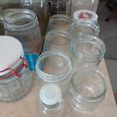 Glass jars of all sizes and shapes - some with lids - some without.