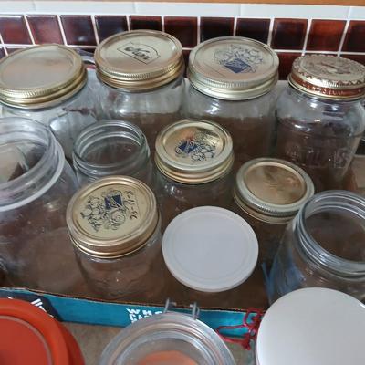 Glass jars of all sizes and shapes - some with lids - some without.