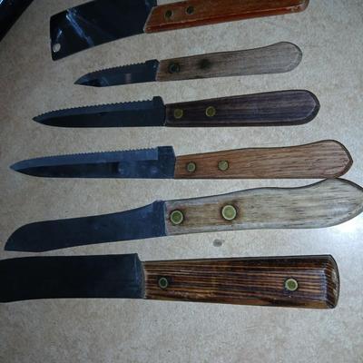 Chrome colored toaster with small electric chopper and wood handled knives