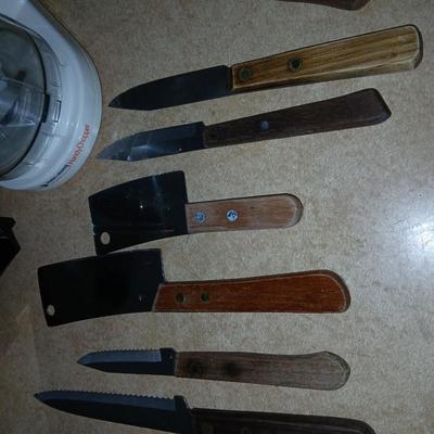 Chrome colored toaster with small electric chopper and wood handled knives