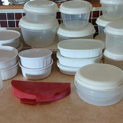 Plastic food storage containers with a few corning ware bowls