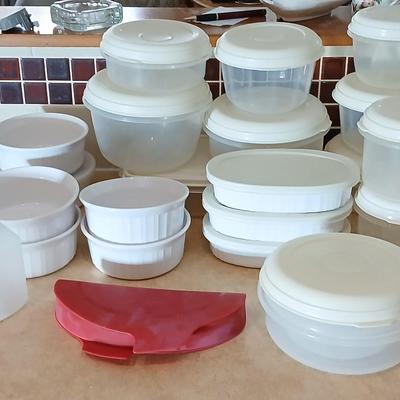 Plastic food storage containers with a few corning ware bowls