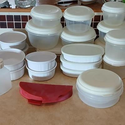 Plastic food storage containers with a few corning ware bowls