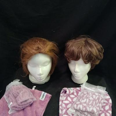 Two Styrofoam heads with wigs and two Turbie hair towels