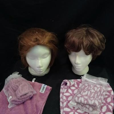 Two Styrofoam heads with wigs and two Turbie hair towels