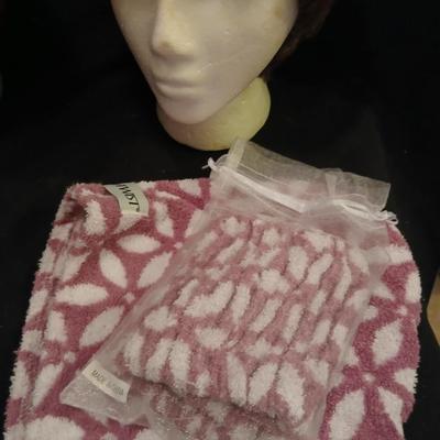 Two Styrofoam heads with wigs and two Turbie hair towels