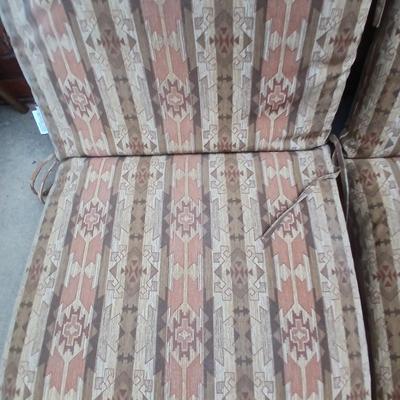 Two southwest print patio chair cushions with chair covers