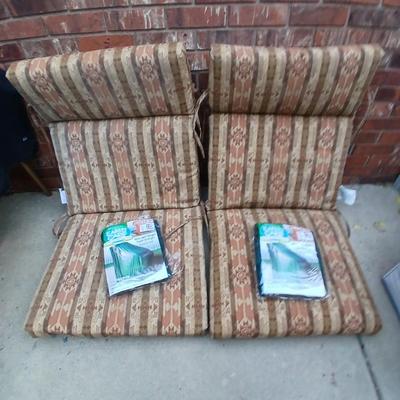 Two southwest print patio chair cushions with chair covers