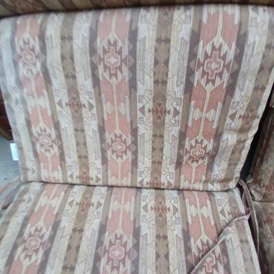 Two southwest print patio chair cushions with chair covers