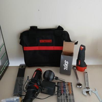 Tool bag with an assortment of tools, Craftsman screwdriver, small screwdriver set, skill screwdriver, a flashlight and more