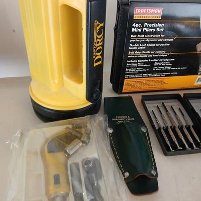Large flashlight with precise screwdriver set, and new Craftsman plier set