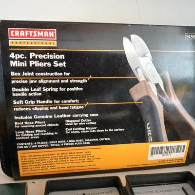 Large flashlight with precise screwdriver set, and new Craftsman plier set