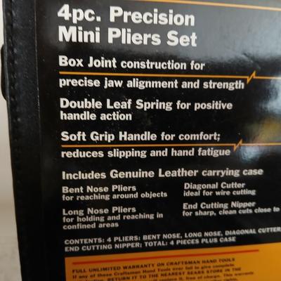 Large flashlight with precise screwdriver set, and new Craftsman plier set