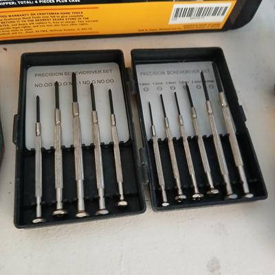 Large flashlight with precise screwdriver set, and new Craftsman plier set