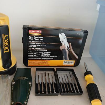 Large flashlight with precise screwdriver set, and new Craftsman plier set
