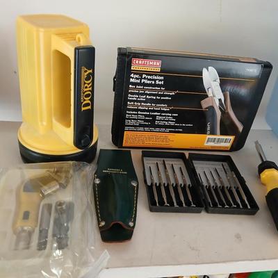 Large flashlight with precise screwdriver set, and new Craftsman plier set